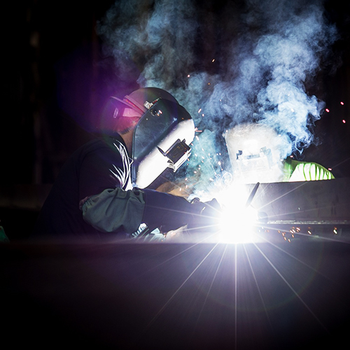 two welders at work