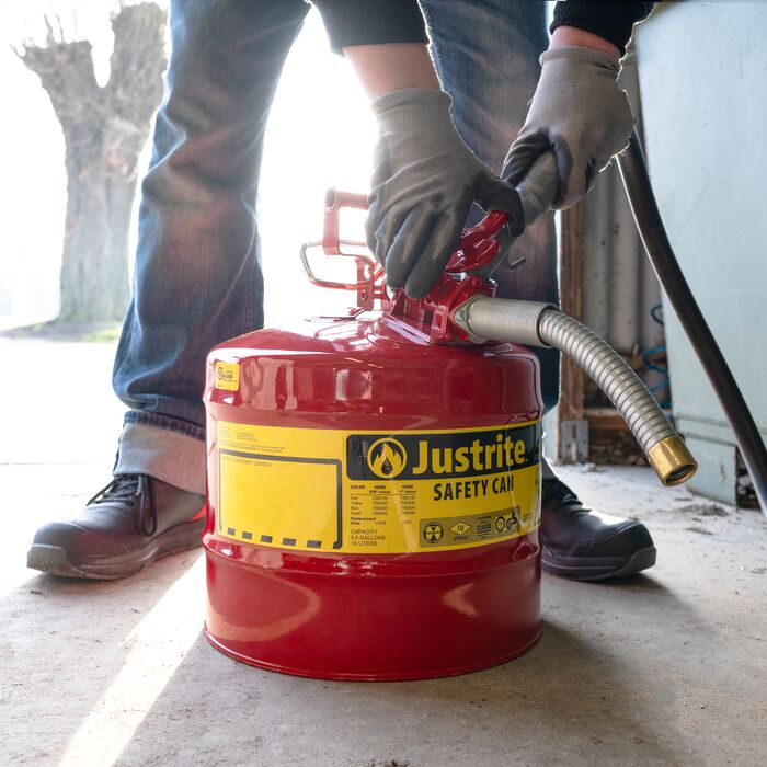 justrite safety can being filled with fuel